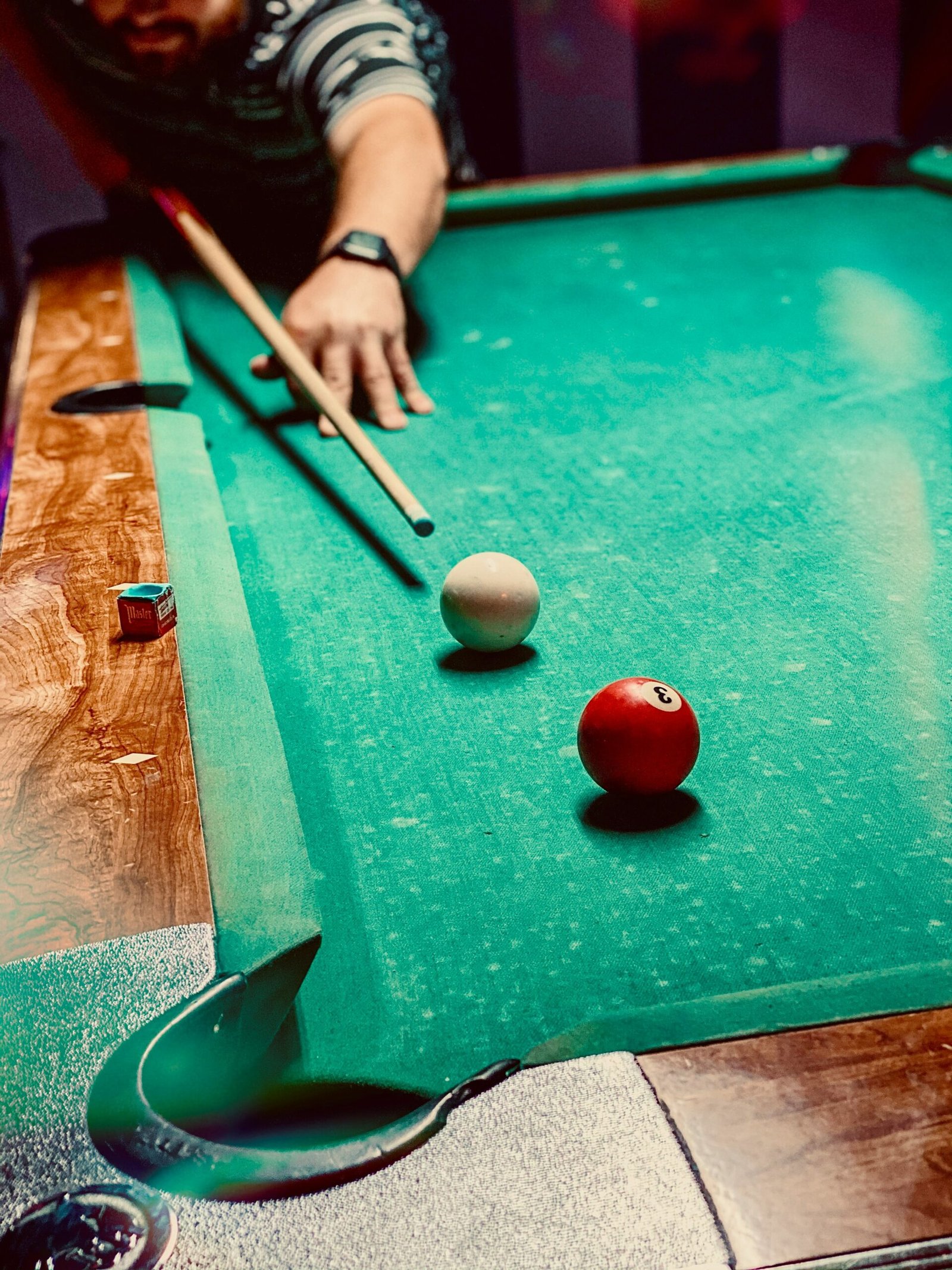 red tomato on green billiard table